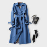 Merike | Klasszikus hosszú trench coat övvel" can be rewritten as: "Merike | Elegáns hosszú trench coat övvel