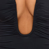 Fekete Slinky Jersey Mély V-nyakú Ráncolt Mini Ruha" can be rewritten as:

"Fekete Slinky Jersey Mini Ruha Mély V-nyakkal és Ráncolt Részletekkel