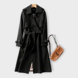 Merike | Klasszikus hosszú trench coat övvel" can be rewritten as: "Merike | Elegáns hosszú trench coat övvel
