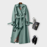 Merike | Klasszikus hosszú trench coat övvel" can be rewritten as: "Merike | Elegáns hosszú trench coat övvel