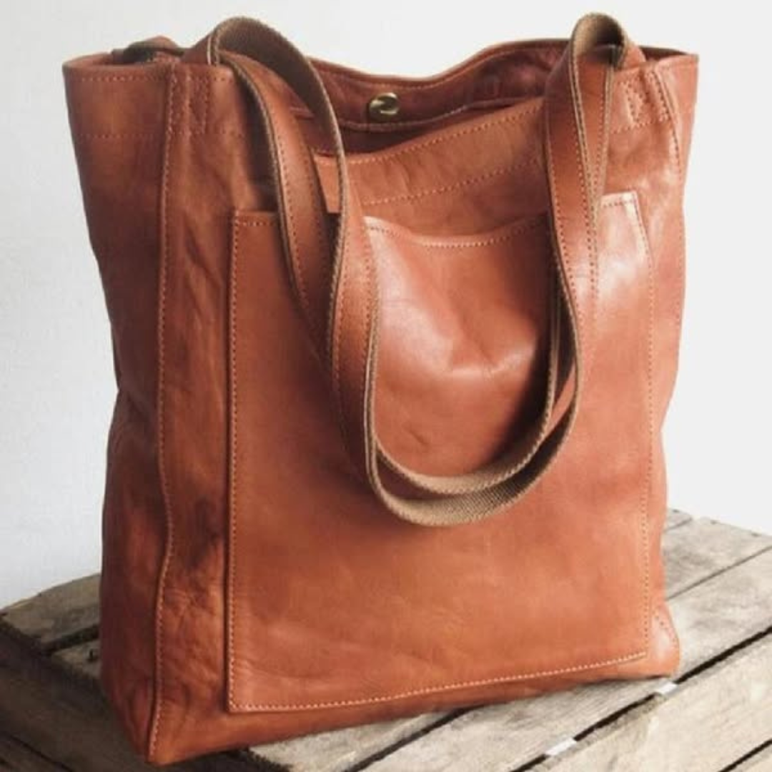 "Pärand | Bőr Tote Táska" can be rewritten as "Pärand | Bőr Tote Táska - Elegáns és Tartós" (Pärand | Leather Tote Bag - Elegant and Durable) if you want to add a descriptive touch. If you prefer a simpler variation, you could say "Pärand | Bőr Tote Táska