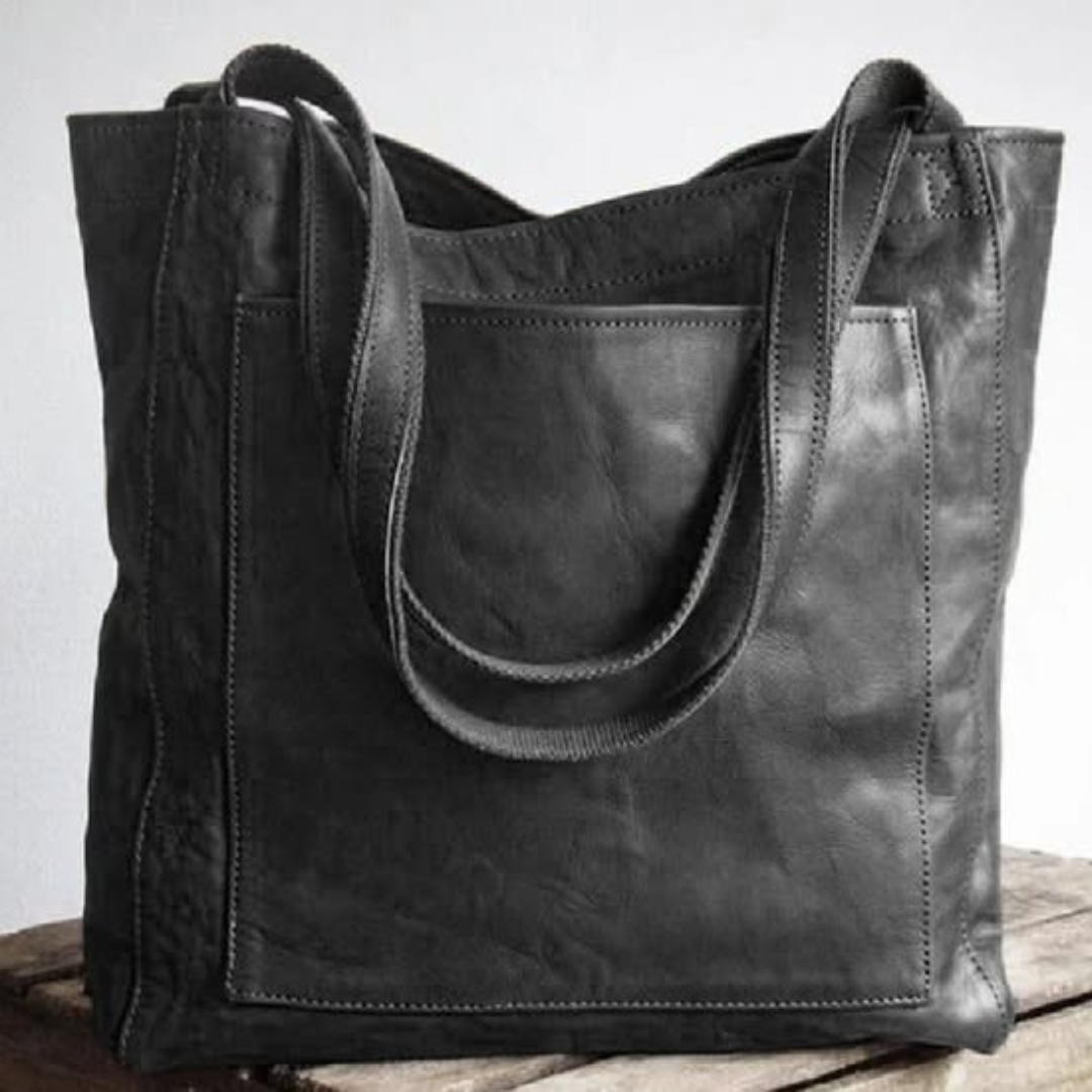 "Pärand | Bőr Tote Táska" can be rewritten as "Pärand | Bőr Tote Táska - Elegáns és Tartós" (Pärand | Leather Tote Bag - Elegant and Durable) if you want to add a descriptive touch. If you prefer a simpler variation, you could say "Pärand | Bőr Tote Táska