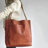"Pärand | Bőr Tote Táska" can be rewritten as "Pärand | Bőr Tote Táska - Elegáns és Tartós" (Pärand | Leather Tote Bag - Elegant and Durable) if you want to add a descriptive touch. If you prefer a simpler variation, you could say "Pärand | Bőr Tote Táska