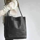 "Pärand | Bőr Tote Táska" can be rewritten as "Pärand | Bőr Tote Táska - Elegáns és Tartós" (Pärand | Leather Tote Bag - Elegant and Durable) if you want to add a descriptive touch. If you prefer a simpler variation, you could say "Pärand | Bőr Tote Táska