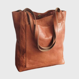 "Pärand | Bőr Tote Táska" can be rewritten as "Pärand | Bőr Tote Táska - Elegáns és Tartós" (Pärand | Leather Tote Bag - Elegant and Durable) if you want to add a descriptive touch. If you prefer a simpler variation, you could say "Pärand | Bőr Tote Táska