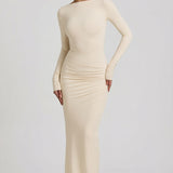 "Ivory Színű, Ráncolt, Háton Nyitott Maxi Ruha" can be rewritten as "Ivory Ruffled Open-Back Maxi Dress".