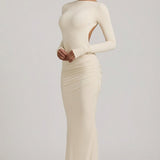 "Ivory Színű, Ráncolt, Háton Nyitott Maxi Ruha" can be rewritten as "Ivory Ruffled Open-Back Maxi Dress".