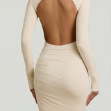 "Ivory Színű, Ráncolt, Háton Nyitott Maxi Ruha" can be rewritten as "Ivory Ruffled Open-Back Maxi Dress".