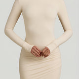 "Ivory Színű, Ráncolt, Háton Nyitott Maxi Ruha" can be rewritten as "Ivory Ruffled Open-Back Maxi Dress".