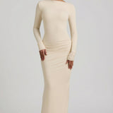 "Ivory Színű, Ráncolt, Háton Nyitott Maxi Ruha" can be rewritten as "Ivory Ruffled Open-Back Maxi Dress".