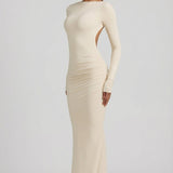 "Ivory Színű, Ráncolt, Háton Nyitott Maxi Ruha" can be rewritten as "Ivory Ruffled Open-Back Maxi Dress".