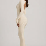 "Ivory Színű, Ráncolt, Háton Nyitott Maxi Ruha" can be rewritten as "Ivory Ruffled Open-Back Maxi Dress".