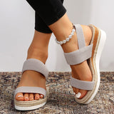 Női Woven Elastic Strap Vastag Talpú Wedge Szandál" can be rewritten as:

"Női Széles Talpú Wedge Szandál Woven Elastic Pánttal